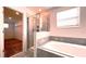 Bathroom features a shower, garden tub, and walk-in closet at 2306 Amorie Dr, Kissimmee, FL 34746
