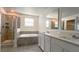 Bathroom features a large soaking tub, double vanity and walk-in shower at 2306 Amorie Dr, Kissimmee, FL 34746