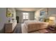 Spacious bedroom with large window, plush bedding and elegant decor at 2306 Amorie Dr, Kissimmee, FL 34746