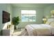 Light and airy bedroom with a king-size bed and large window at 2306 Amorie Dr, Kissimmee, FL 34746