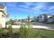 Residential community street view with houses and landscaping at 2306 Amorie Dr, Kissimmee, FL 34746