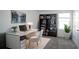 Bright home office features a large desk, built-in shelving and natural light at 2306 Amorie Dr, Kissimmee, FL 34746