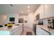 Modern kitchen boasts stainless steel appliances and ample counter space at 2306 Amorie Dr, Kissimmee, FL 34746