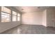 Spacious living room with tile floors and large windows at 2306 Amorie Dr, Kissimmee, FL 34746