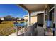 Covered patio with outdoor dining furniture and a built-in grill at 2306 Amorie Dr, Kissimmee, FL 34746