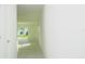 Bright hallway with view into backyard through sliding glass doors at 2343 Amorie Dr, Kissimmee, FL 34746