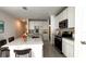 Modern kitchen with stainless steel appliances and white cabinetry, features an island at 2343 Amorie Dr, Kissimmee, FL 34746