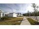Row of houses with front yards and sidewalks at 2343 Amorie Dr, Kissimmee, FL 34746