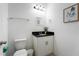 Clean bathroom with a white vanity and granite countertop at 476 Lake Shore Pkwy, Davenport, FL 33896