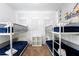 Spacious bedroom with two sets of bunk beds, perfect for families at 476 Lake Shore Pkwy, Davenport, FL 33896