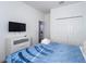 Bedroom with a queen bed, dresser, and large closet at 476 Lake Shore Pkwy, Davenport, FL 33896