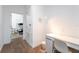 Bright hallway with a desk, a nearby bedroom, and neutral carpet at 476 Lake Shore Pkwy, Davenport, FL 33896