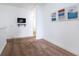 Spacious loft area with neutral carpeting and a wall-mounted TV at 476 Lake Shore Pkwy, Davenport, FL 33896
