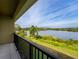 Balcony overlooking a serene lake and lush landscape at 476 Lake Shore Pkwy, Davenport, FL 33896