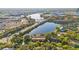 Aerial view of condo building by the lake at 510 Cranes Way # 306, Altamonte Springs, FL 32701