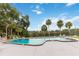 Community pool with palm trees and waterfront views at 510 Cranes Way # 306, Altamonte Springs, FL 32701