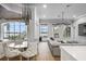 Breakfast nook with a round table and chairs, overlooking the pool and lake at 6009 Lady Bet Dr, Orlando, FL 32819