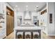 Modern kitchen with white cabinets, quartz countertops, and a large island at 6009 Lady Bet Dr, Orlando, FL 32819