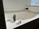 Relaxing bathtub with chrome fixtures at 612 Bloomingdale Dr, Davenport, FL 33897
