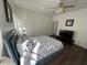 Bright bedroom with a king-size bed and TV at 612 Bloomingdale Dr, Davenport, FL 33897