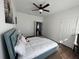 Spacious bedroom with a large bed, plenty of natural light, and a view to another room at 612 Bloomingdale Dr, Davenport, FL 33897