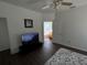 Bedroom with ensuite bathroom and a large TV at 612 Bloomingdale Dr, Davenport, FL 33897
