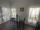 Breakfast nook with glass-top table and chairs, offering natural light at 612 Bloomingdale Dr, Davenport, FL 33897