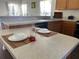 Kitchen island with place settings for two at 612 Bloomingdale Dr, Davenport, FL 33897