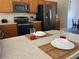 Modern kitchen with stainless steel appliances at 612 Bloomingdale Dr, Davenport, FL 33897