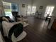 Living room with access to the pool area, featuring a sofa and comfortable seating at 612 Bloomingdale Dr, Davenport, FL 33897