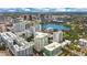 High-rise building with pool, surrounded by cityscape at 100 S Eola Dr # 1411, Orlando, FL 32801