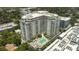 High-rise building with pool and surrounding cityscape at 100 S Eola Dr # 1411, Orlando, FL 32801
