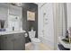 Clean bathroom with a tub, shower, and gray vanity at 100 S Eola Dr # 1411, Orlando, FL 32801