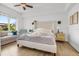Bright bedroom with king-size bed and access to balcony at 100 S Eola Dr # 1411, Orlando, FL 32801