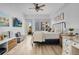 Bright bedroom with hardwood floors, large windows, and a comfortable sitting area at 100 S Eola Dr # 1411, Orlando, FL 32801