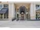 Modern building entrance with awning and access ramp at 100 S Eola Dr # 1411, Orlando, FL 32801