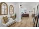 Bright entryway with bench, mirrors, and view to living area at 100 S Eola Dr # 1411, Orlando, FL 32801