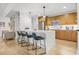 Modern kitchen with light wood cabinets and white countertops at 100 S Eola Dr # 1411, Orlando, FL 32801