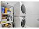 Convenient laundry room with washer, dryer, and storage shelves at 100 S Eola Dr # 1411, Orlando, FL 32801