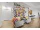Living area with gray chairs and graffiti wall art at 100 S Eola Dr # 1411, Orlando, FL 32801