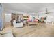 Open living area with hardwood floors and eclectic decor at 100 S Eola Dr # 1411, Orlando, FL 32801