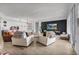 Bright living room features hardwood floors, comfortable seating, and a large TV at 100 S Eola Dr # 1411, Orlando, FL 32801
