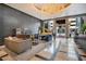 Elegant lobby with seating area, grand chandelier, and piano at 100 S Eola Dr # 1411, Orlando, FL 32801