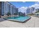 Inviting resort-style pool with surrounding lounge chairs and cabanas at 100 S Eola Dr # 1411, Orlando, FL 32801