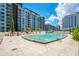 Community pool with plenty of lounge chairs at 100 S Eola Dr # 1411, Orlando, FL 32801