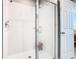 Walk-in shower with glass door and tiled walls at 108 Towns Cir, Haines City, FL 33844