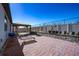 Relaxing backyard patio with a pergola, lounge chairs, and a fire pit at 1251 Citrus Landing Blvd, Davenport, FL 33837