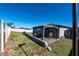 Landscaped backyard with a pergola and patio area at 1251 Citrus Landing Blvd, Davenport, FL 33837