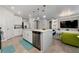 Modern kitchen with island, stainless steel appliances, and white cabinets at 1251 Citrus Landing Blvd, Davenport, FL 33837