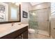 Bathroom with walk-in shower, vanity, and toilet at 15939 Vetta Dr, Montverde, FL 34756